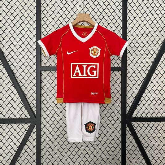 Kit infantil Manchester United Retrô Home 2006 . - Vermelho