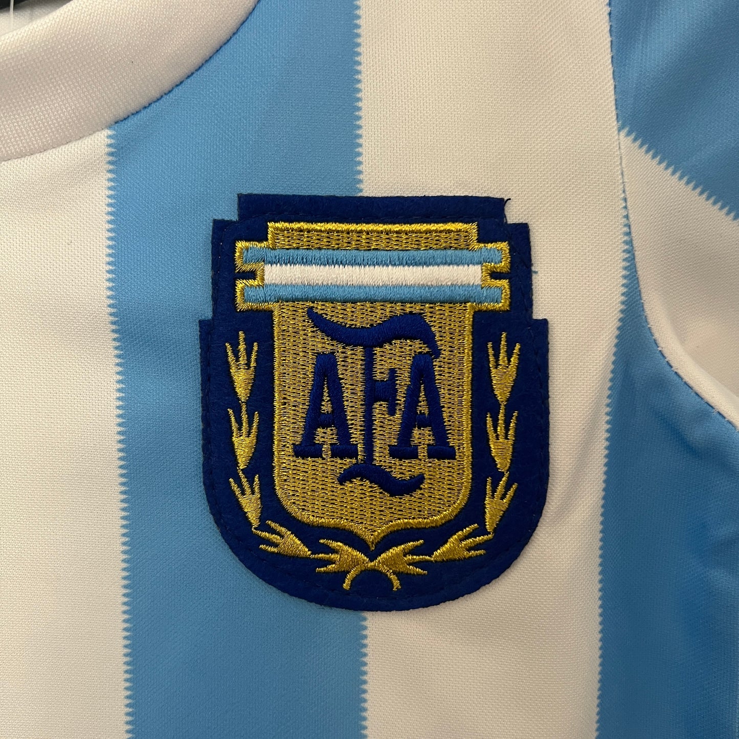 Kit Infantil Argentina Retro Home 1986 Le Coq Sportif -Branco e Azul